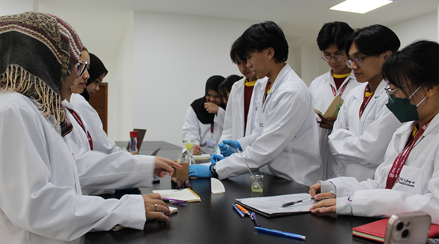 Nursing Course Brunei | A group of JCHS students working with chemicals in a practical session as part of their nursing program curriculum at JPMC College of Health Sciences.